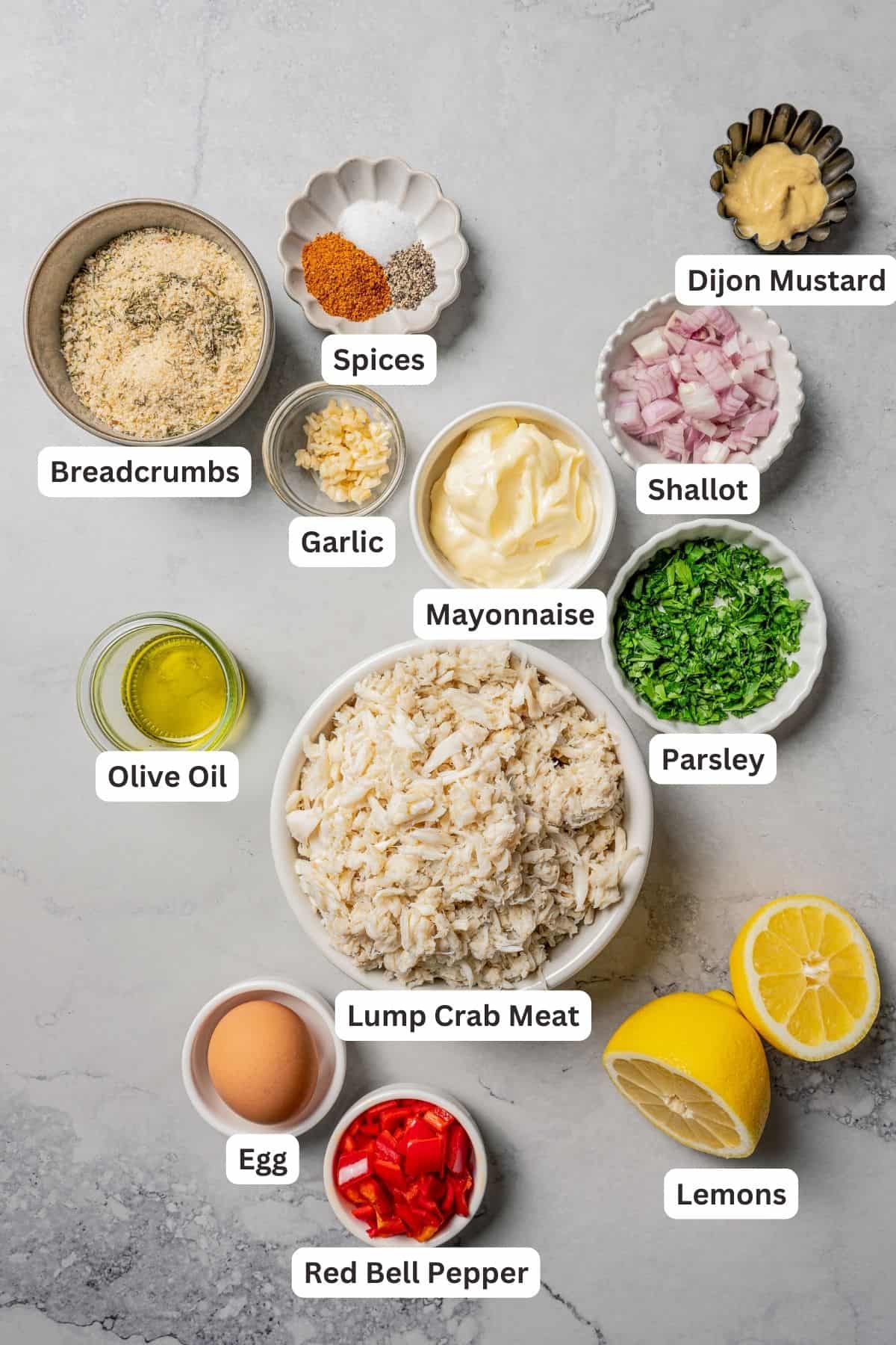 Crab cake ingredients with text labels overlaying each ingredient.