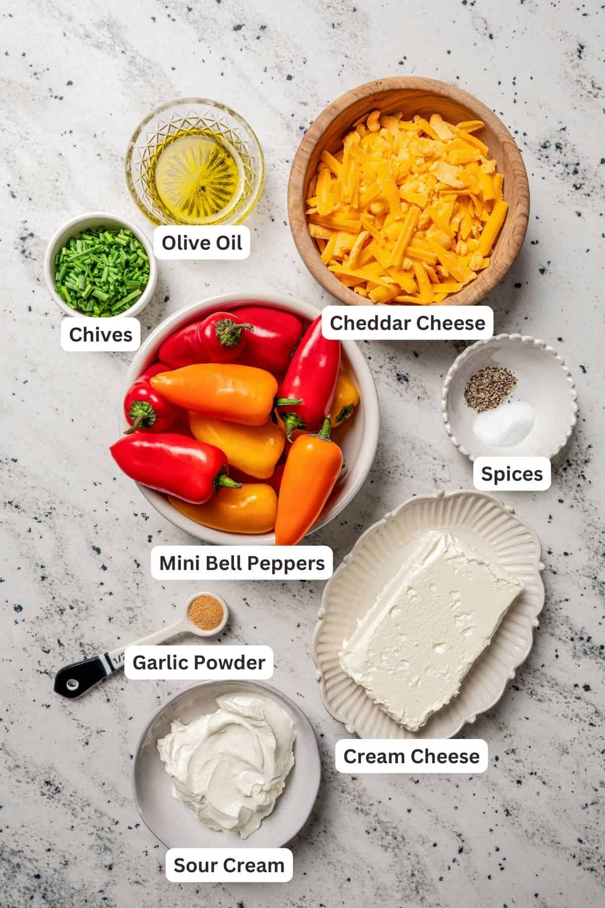 Cream cheese stuffed peppers ingredients with text labels overlaying each ingredient.
