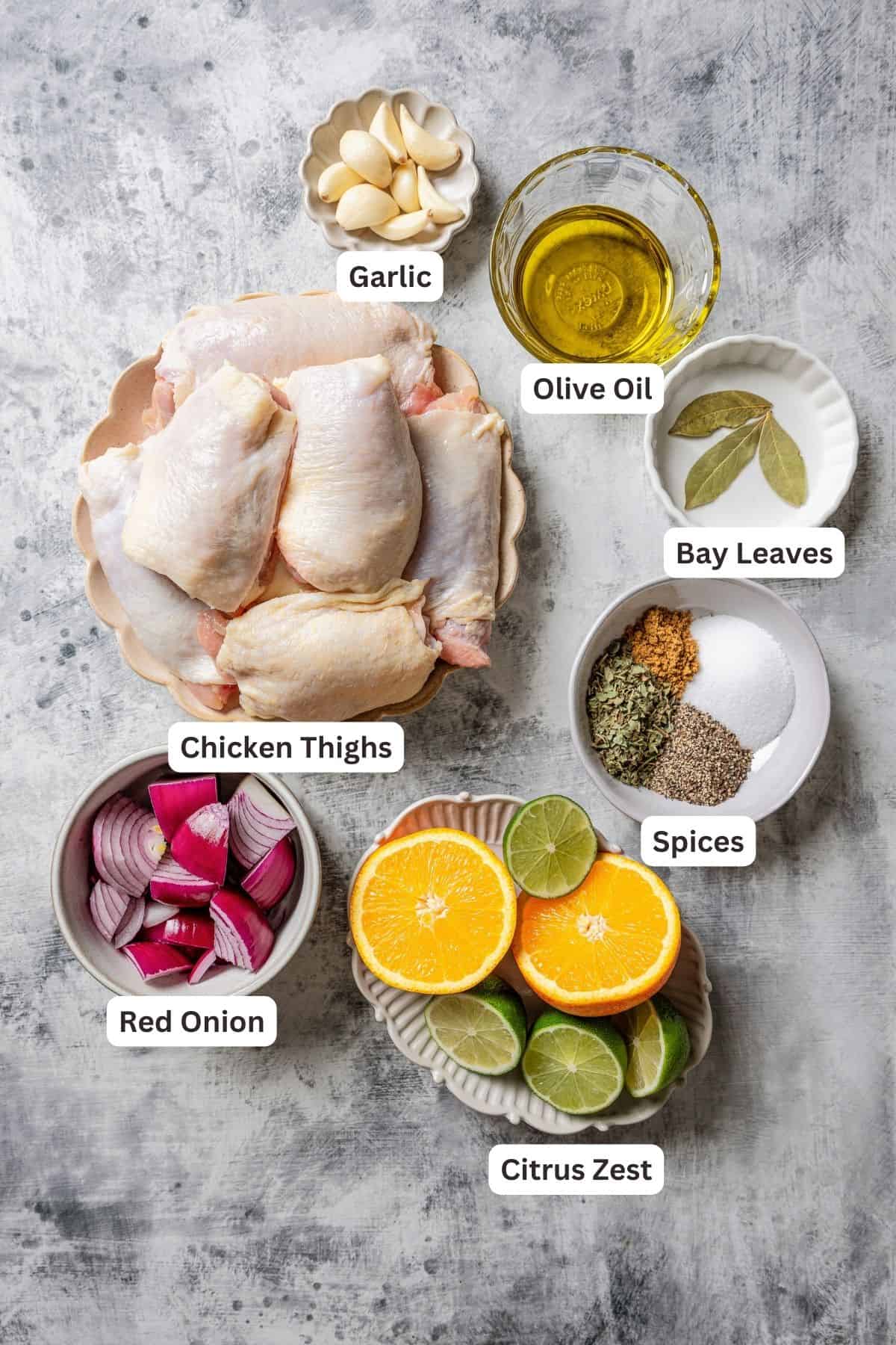 Ingredients for mojo chicken with text labels overlaying each ingredient.