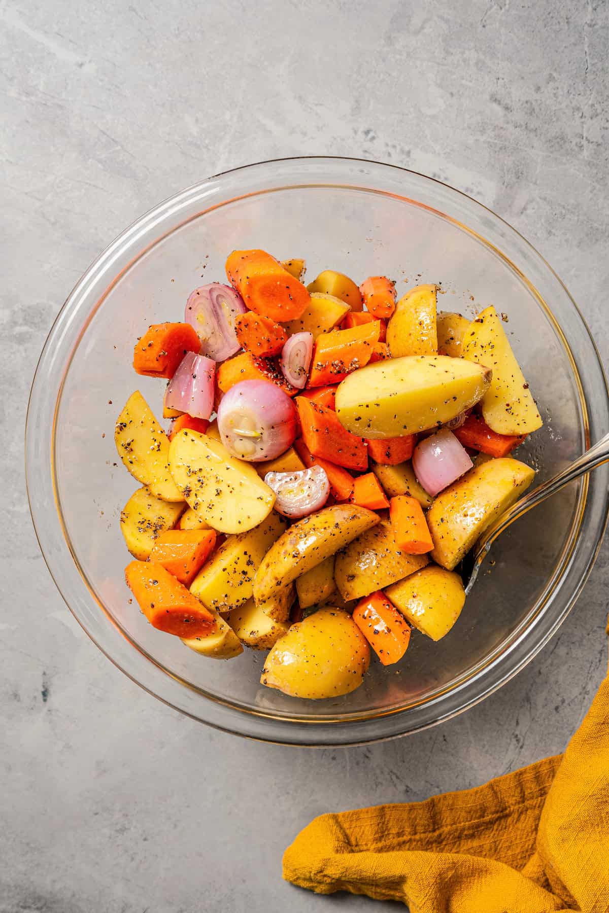 Seasoned vegetables in a glass bowl.