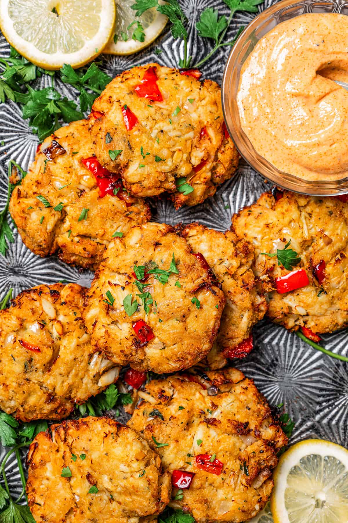 Weekly Meal Plan Air fryer crab cakes served on a tray with a bowl of remoulade.