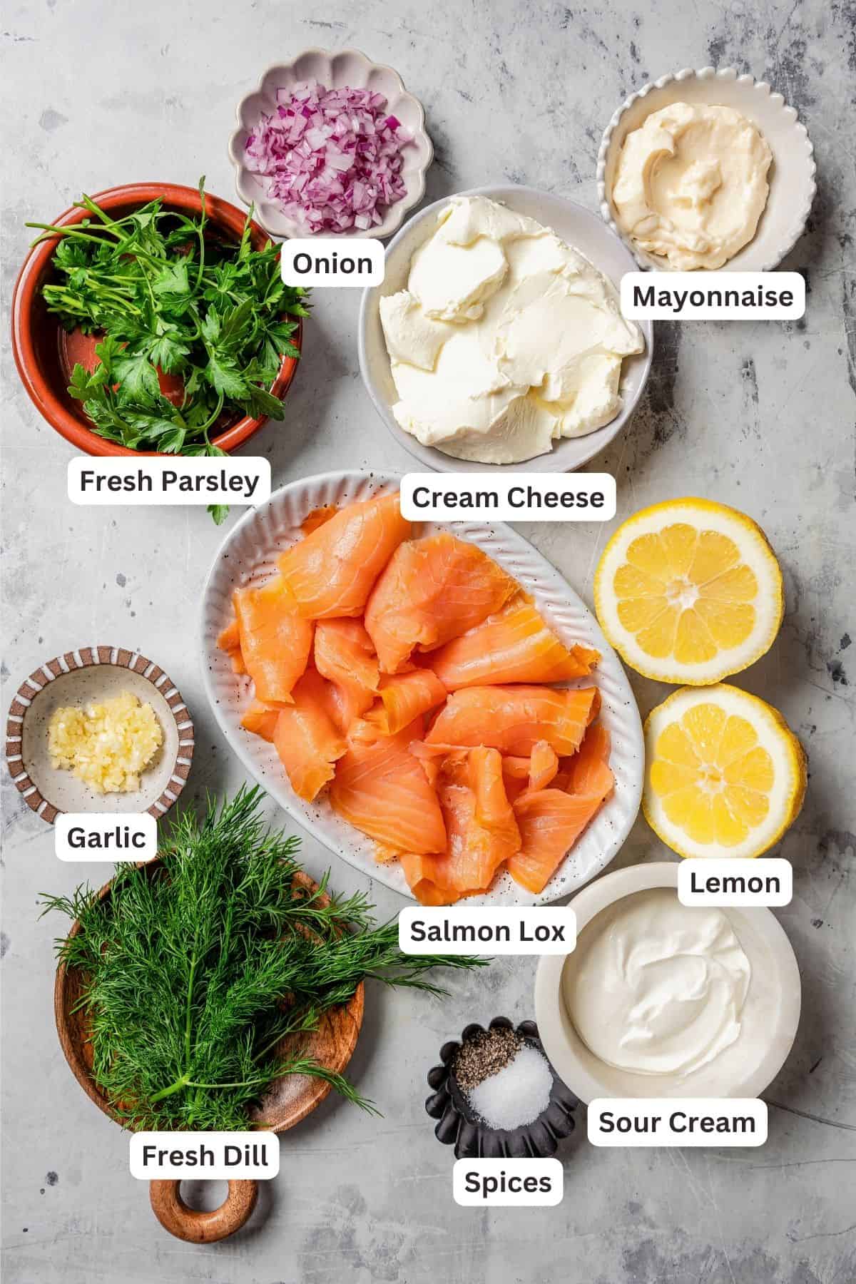 Ingredients for smoked salmon dip with text labels overlaying each ingredient.