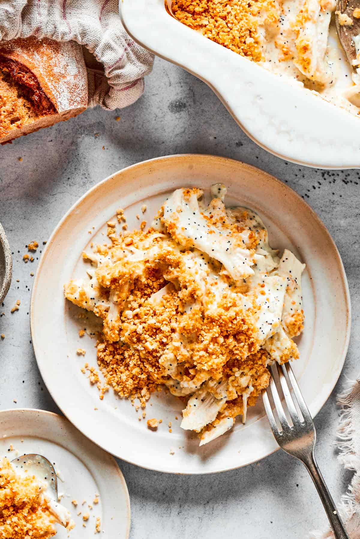 Poppy seed chicken served on a dinner plate.