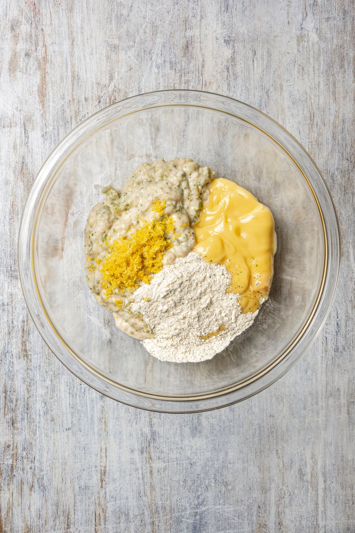 Ingredients for the saucy rice mixture combined in a glass bowl.