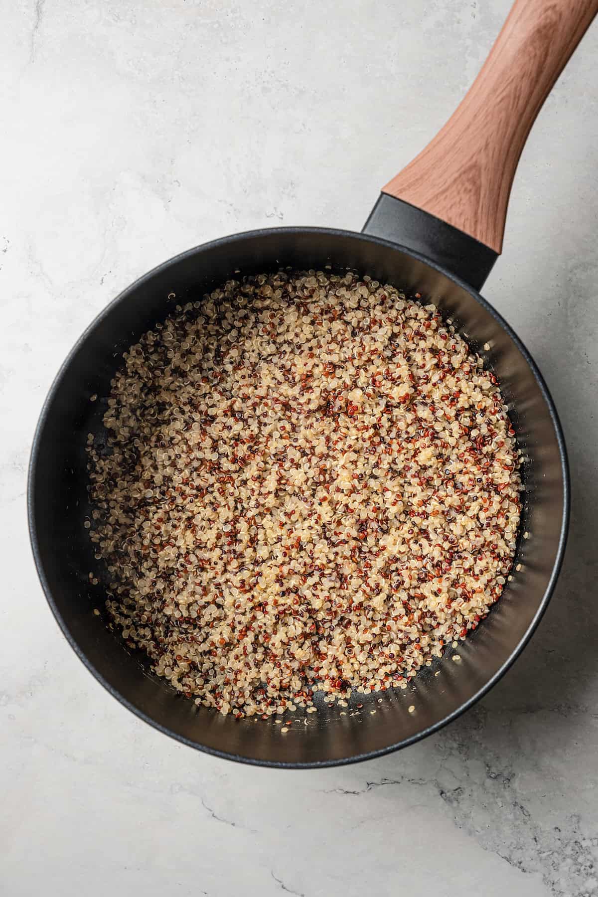 Cooked quinoa in a saucepan.