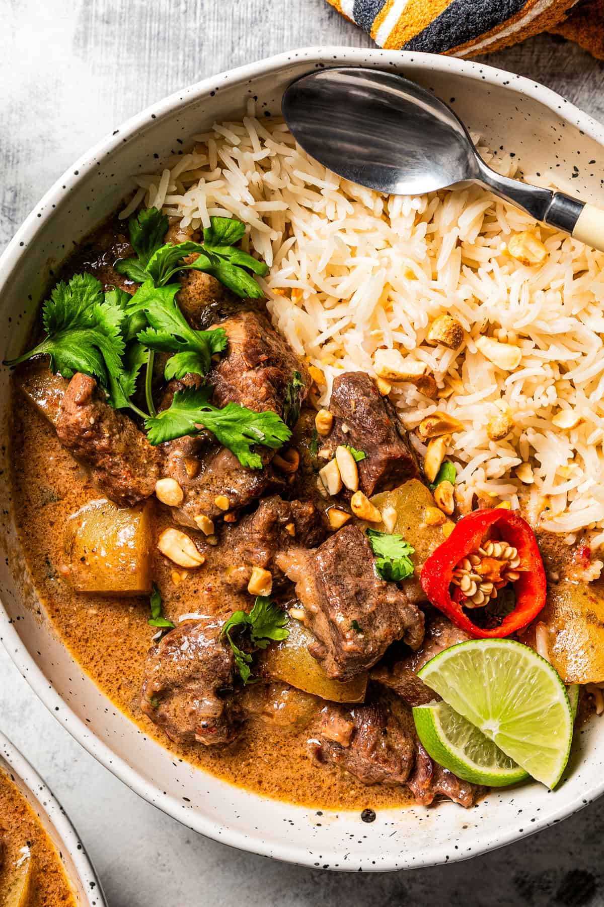 Massaman curry is served in a bowl with rice.