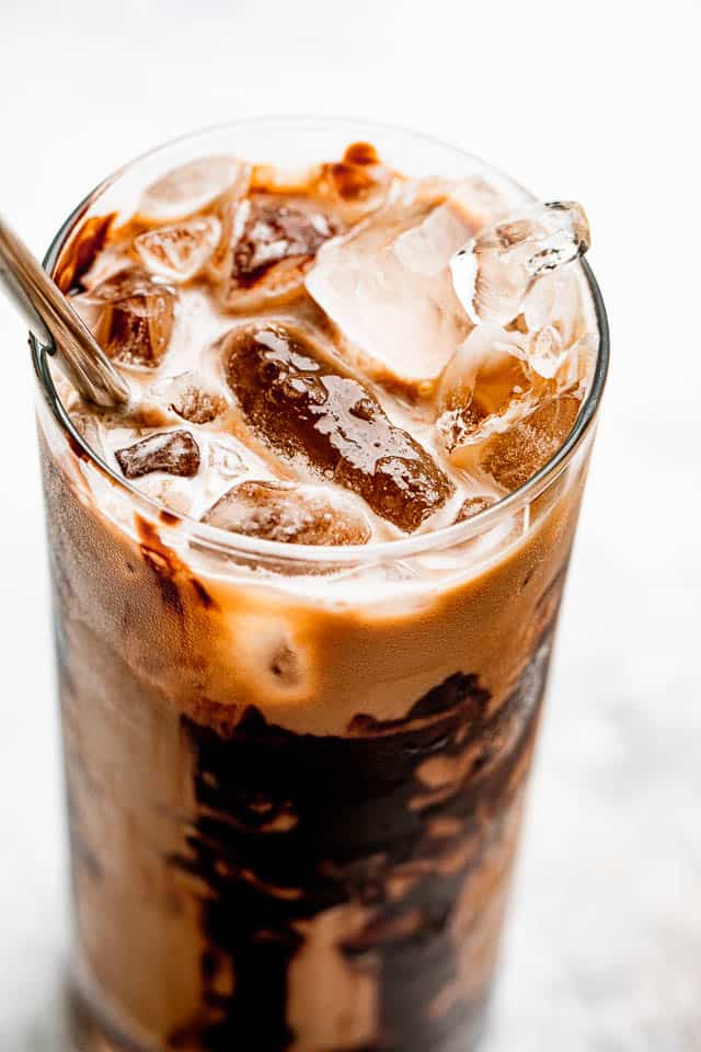 A glass of coffee packed with ice.