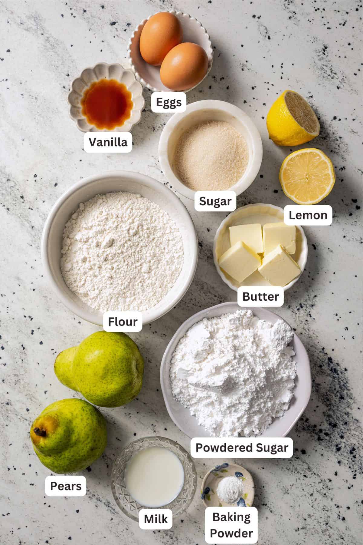 Pear cake ingredients with text labels overlaying each ingredient.