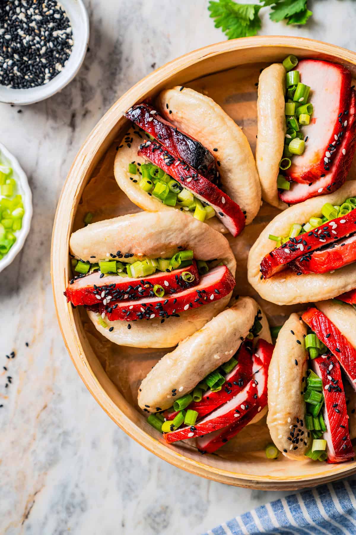 Bao buns in a steamer basket.