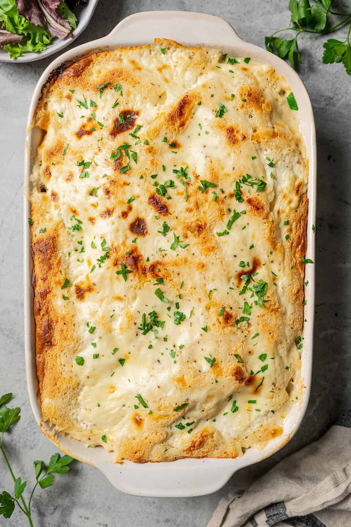 Baked chicken cobbler in a baking dish.