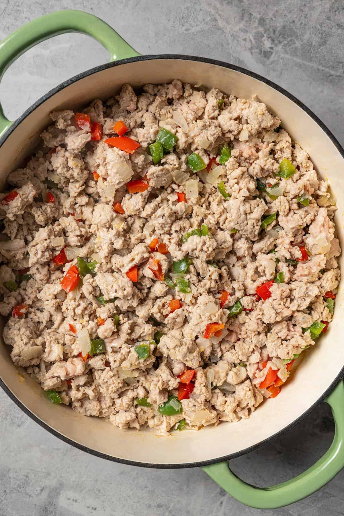 Cooked ground turkey and peppers in a pot.