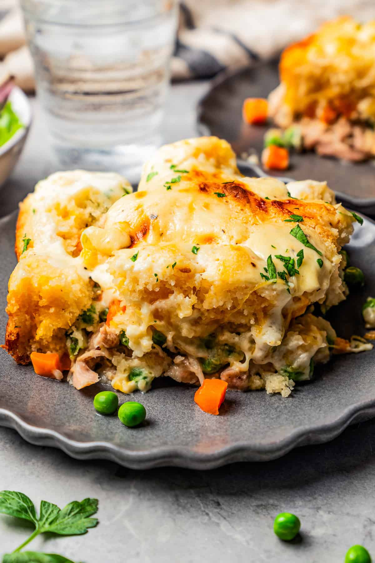 Scoop of chicken cobbler on a plate.