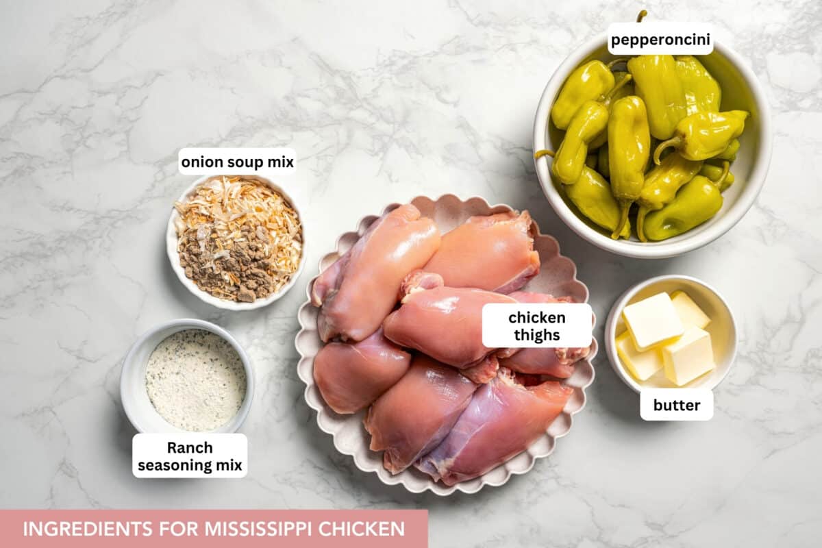 Mississippi chicken is an easy crock pot recipe with juicy chicken shredded in savory pepperoncini ranch sauce. Make it with 5 ingredients! Ingredients for Mississippi chicken with text labels overlaying each ingredient.