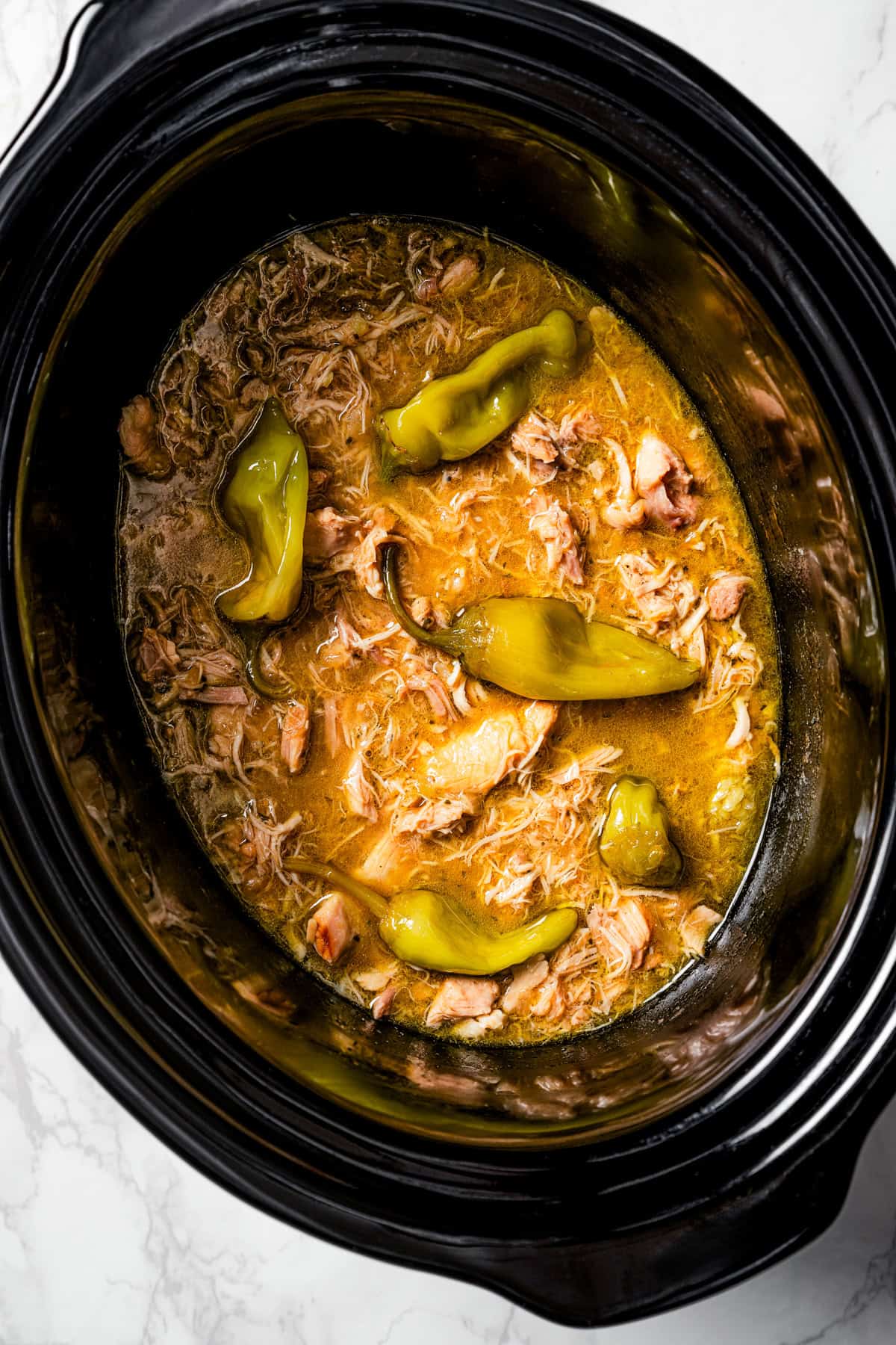 Overhead view of Mississippi chicken inside the slow cooker.