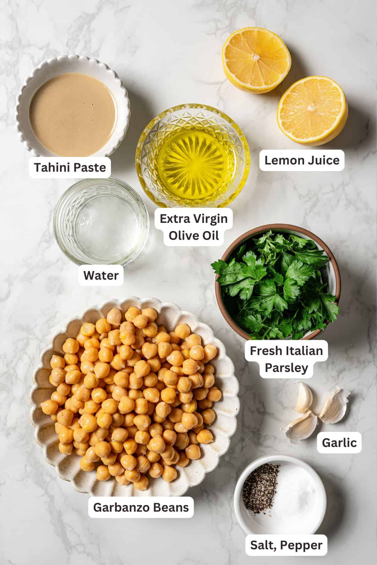 Hummus ingredients with text labels overlaying each ingredient.