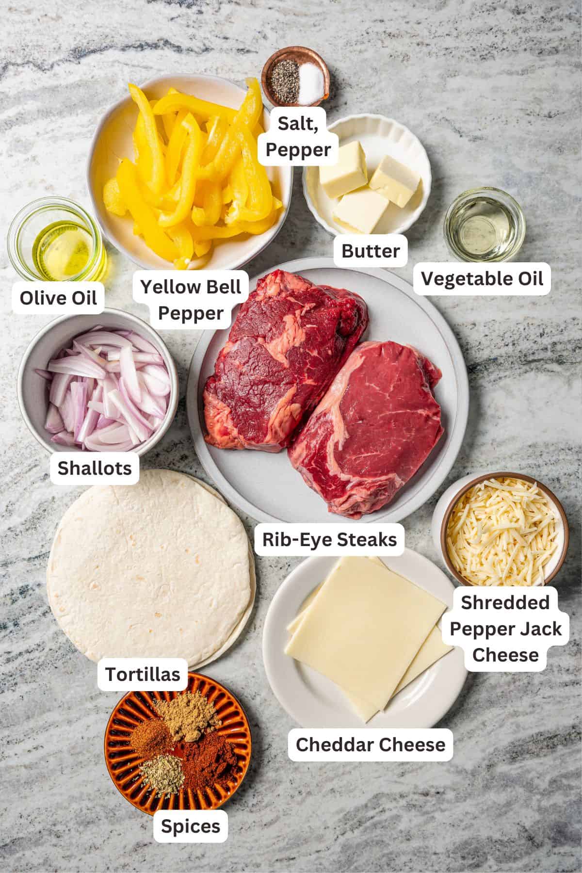 Ingredients for steak quesadillas with text labels overlaying each ingredient.