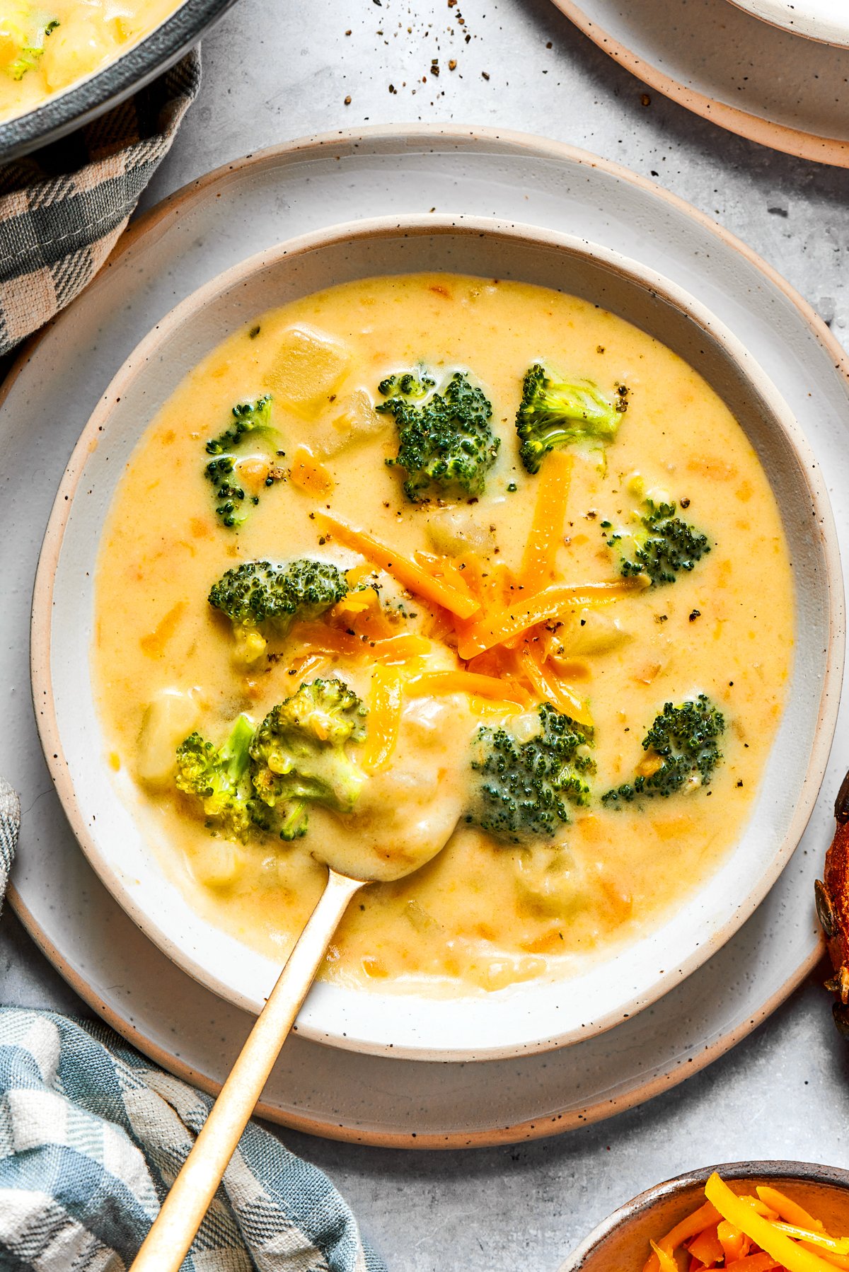 Broccoli cheese soup served in a bowl.