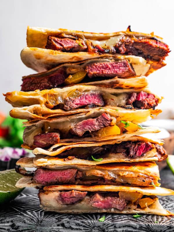 A tower of steak quesadillas stacked on a tray.