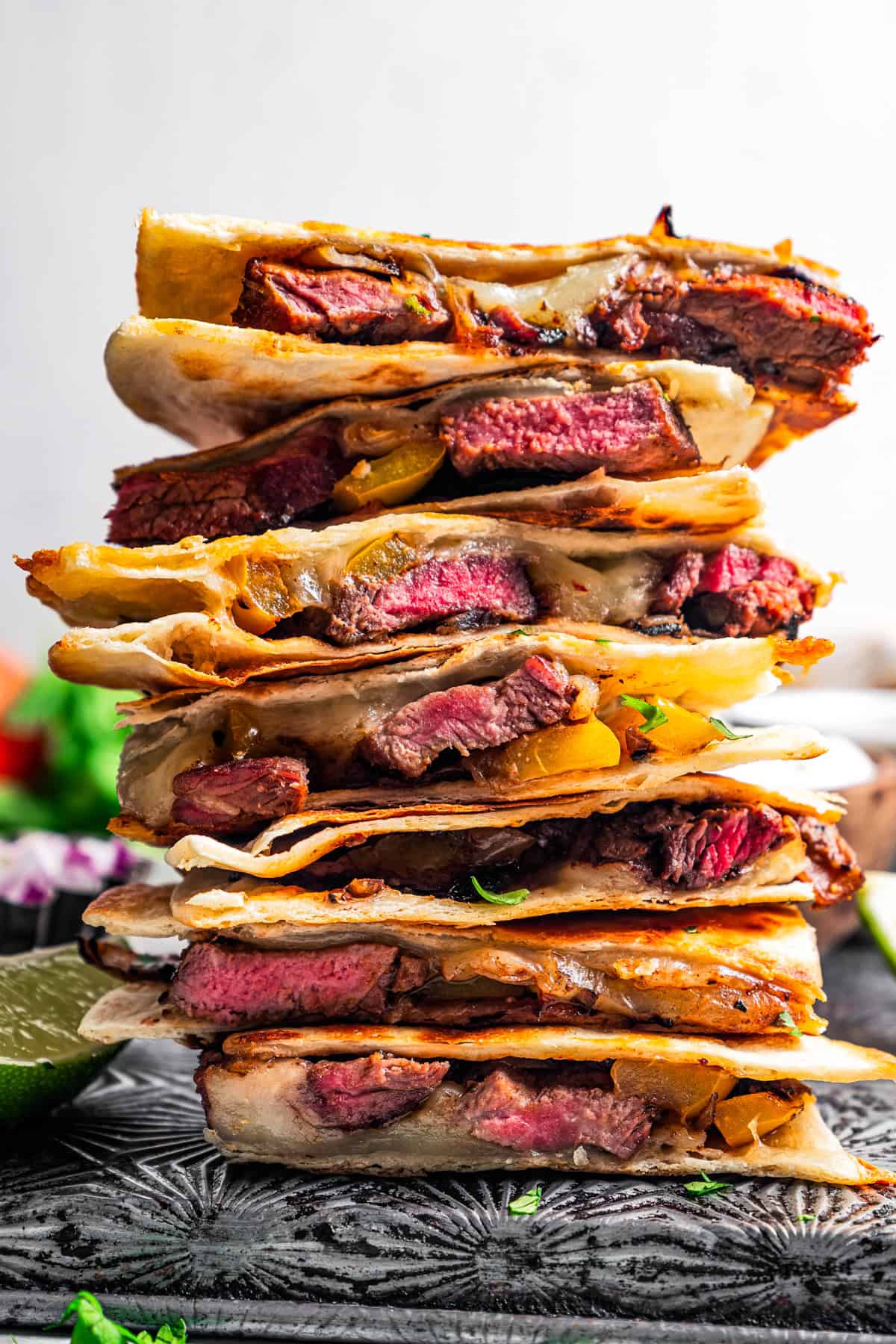 A tower of steak quesadillas stacked on a tray.