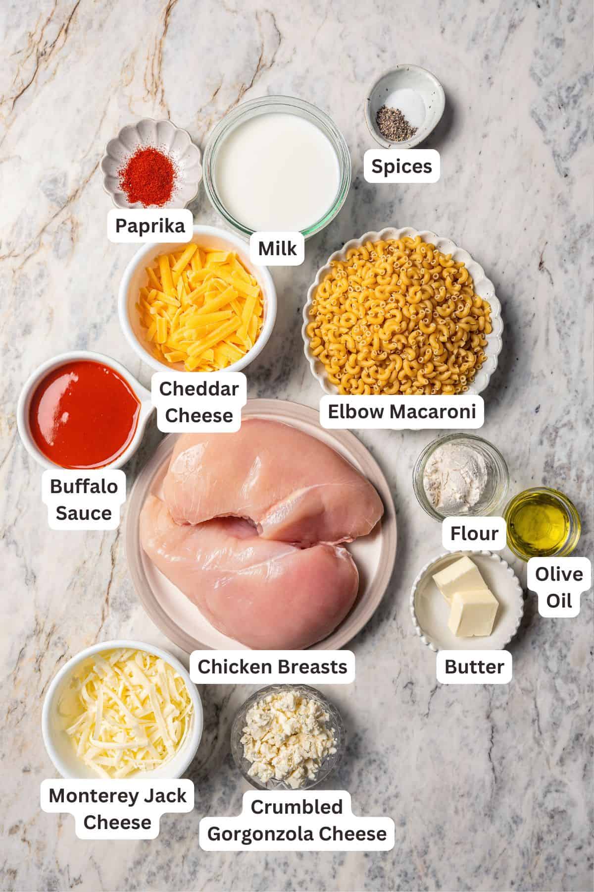 Buffalo mac and cheese ingredients with text labels overlaying each ingredient.