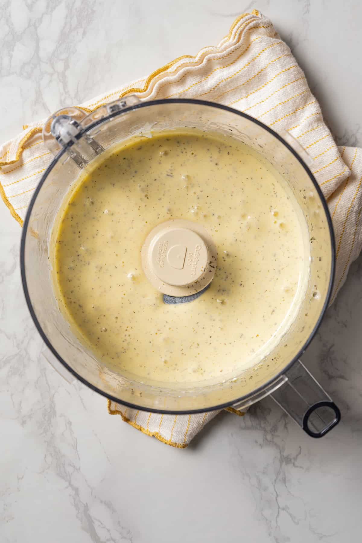 Blended cottage cheese flatbread batter inside the food processor.