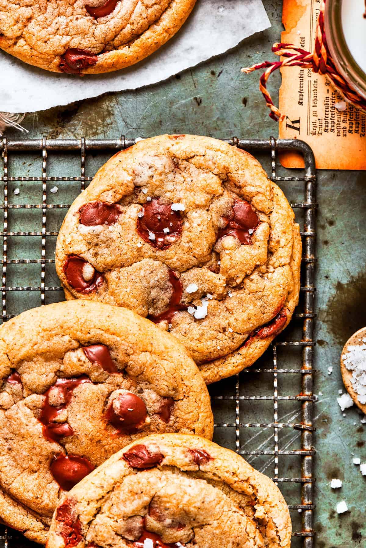 Chocolate chip cookies on a wire rack.