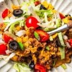 Taco casserole served on a dinner plate.