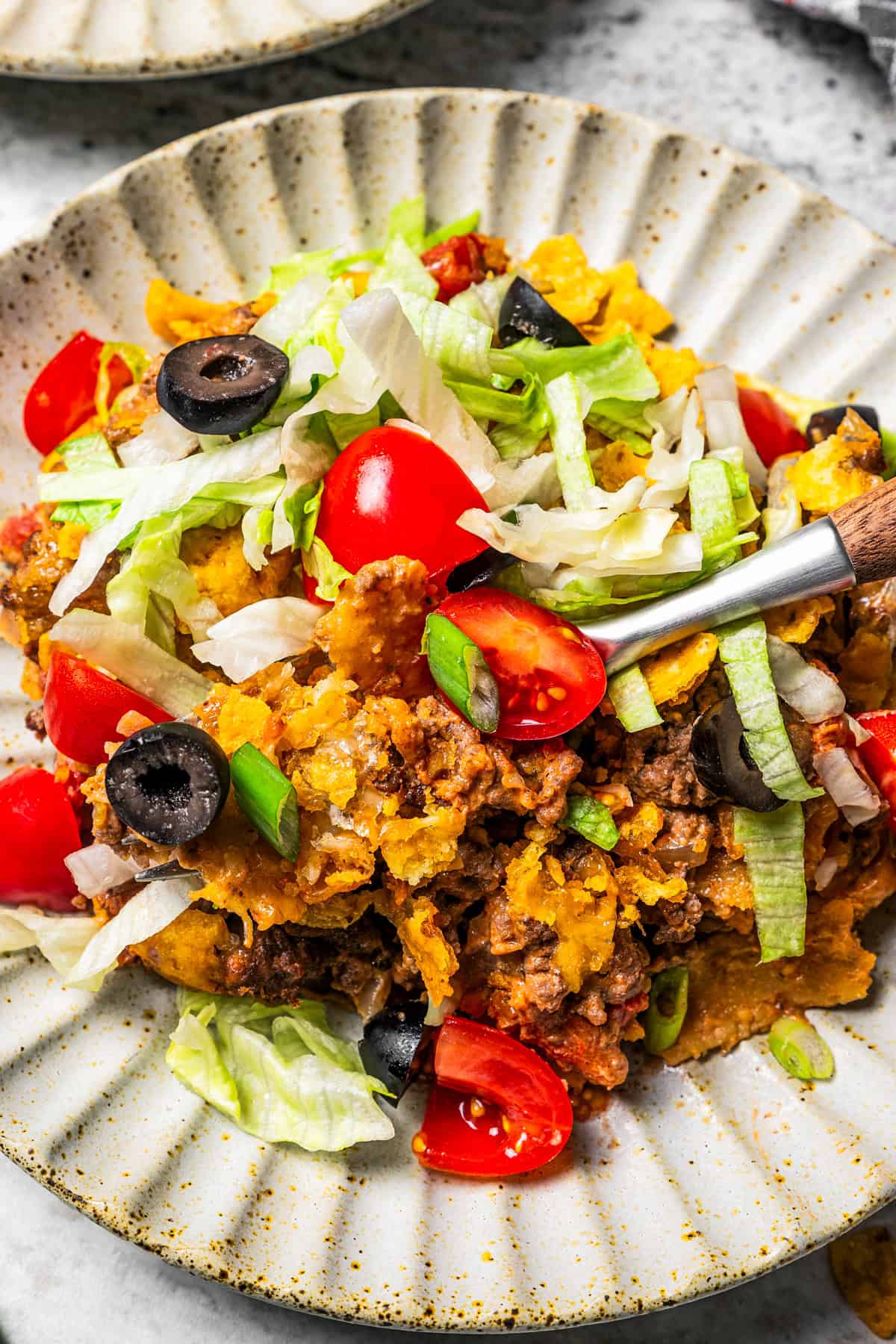 Taco casserole served on a dinner plate.