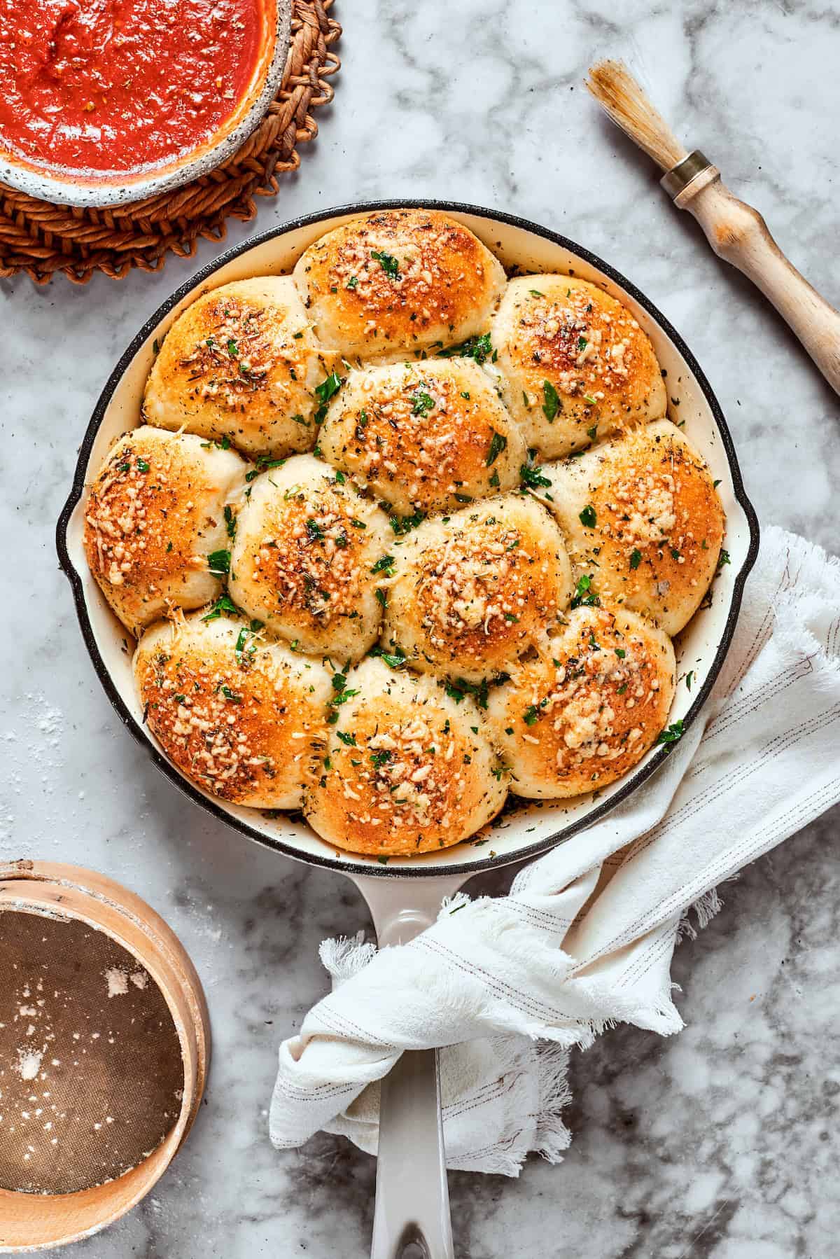 A skillet with biscuits.