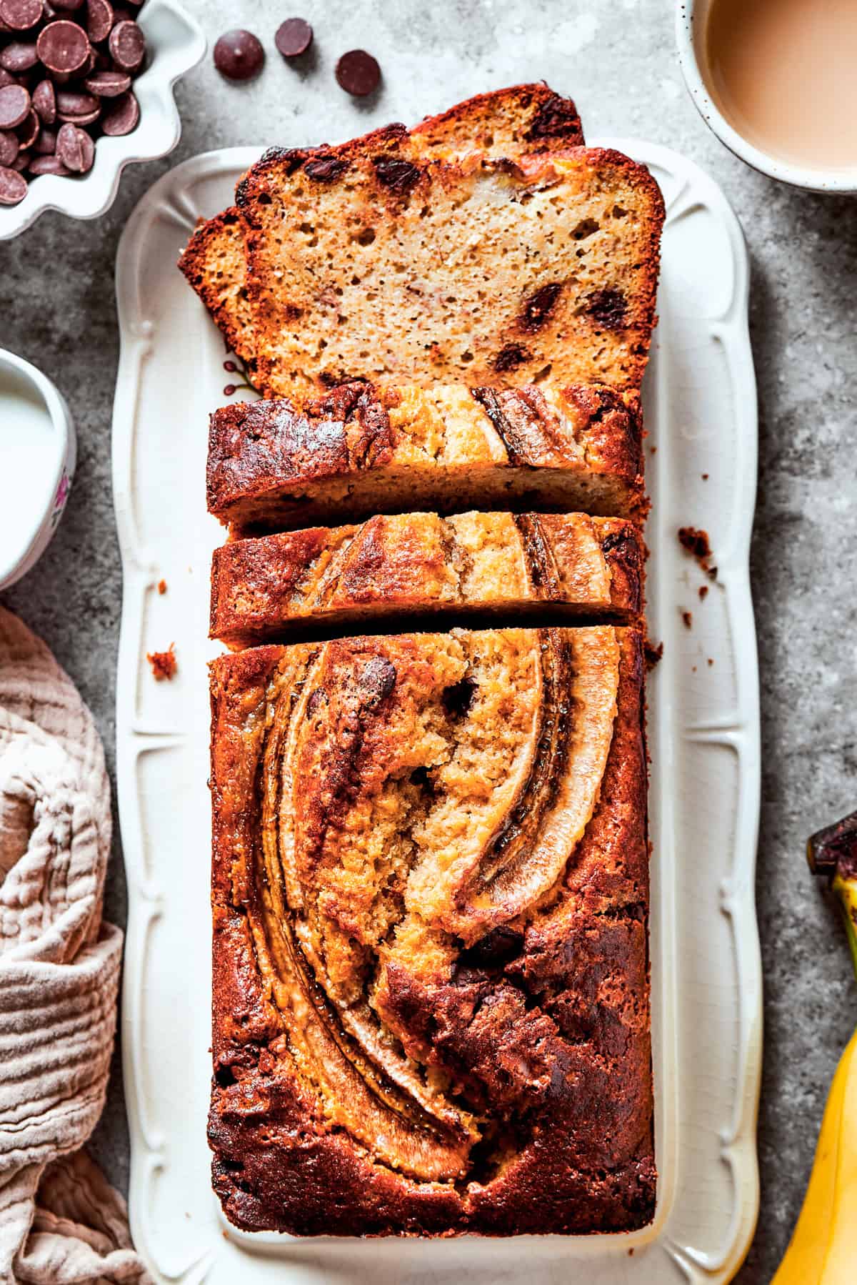 Sour Cream Banana Bread served on a long plate.