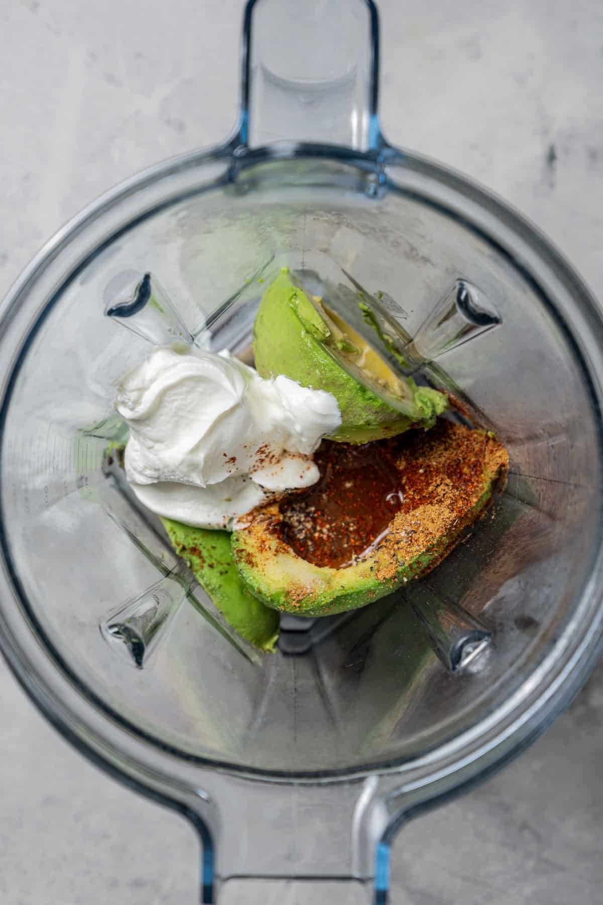 This Southwest avocado dip layers creamy avocado crema with a zesty mix of black beans, sweet corn, and tomatoes. Great with chips or veggies! Avocado, sour cream, and seasonings combined in a blender.