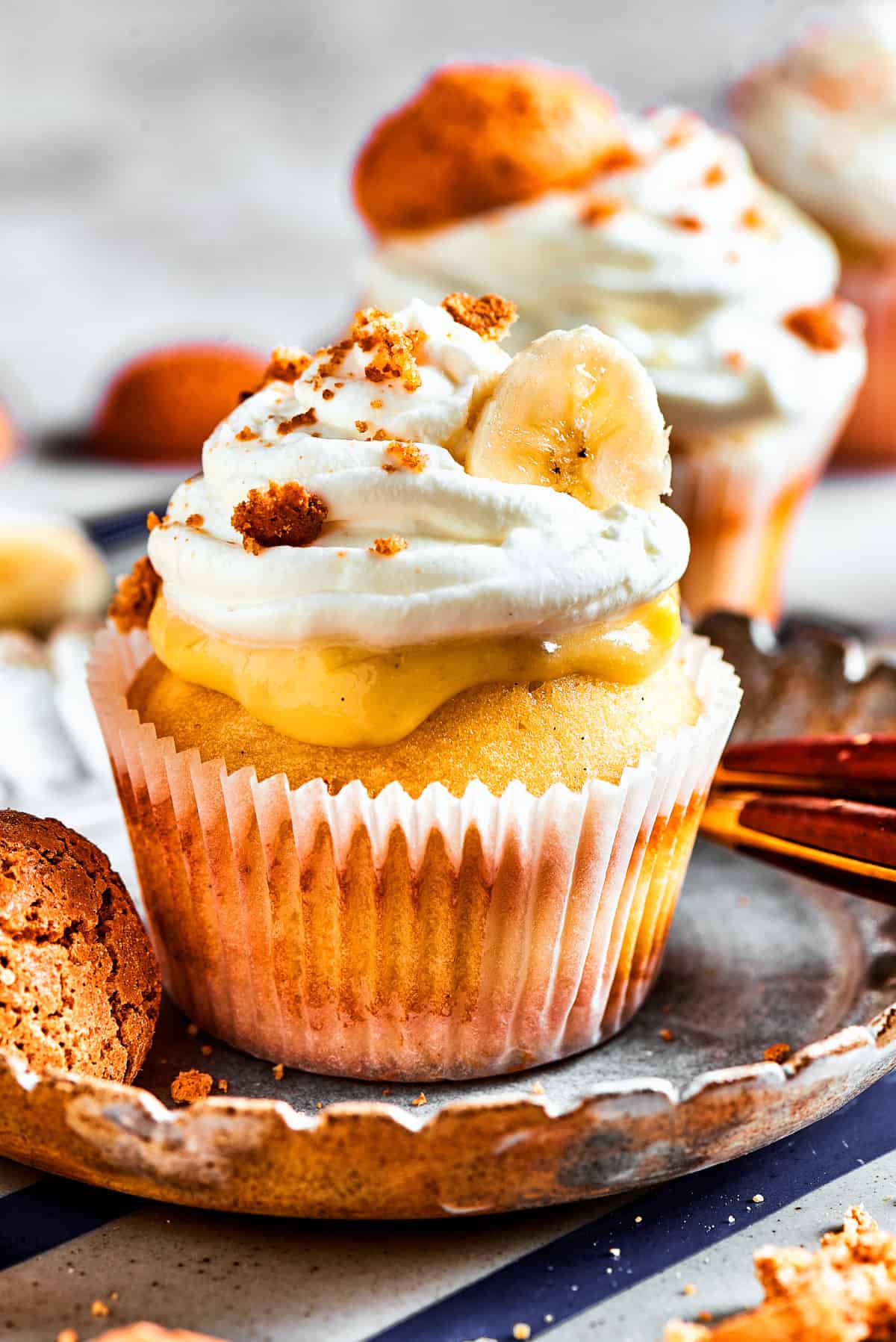 Banana Pudding Cupcakes Cupcakes topped with banana pudding and whipped cream.
