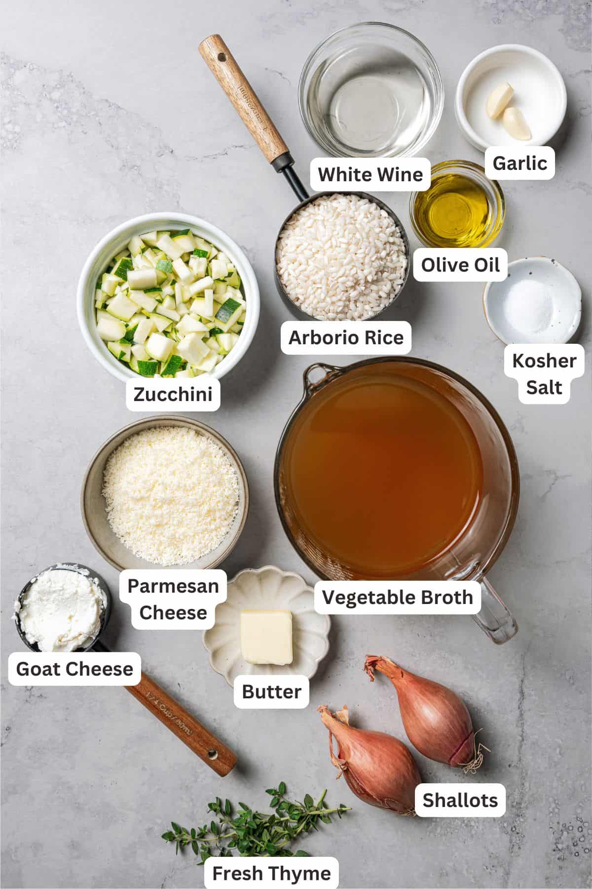 This easy homemade arancini recipe makes crispy, cheesy, golden-fried Italian rice balls filled with melty pockets of tangy goat cheese. Ingredients needed to make the risotto for arancini with text labels overlaying each ingredient.