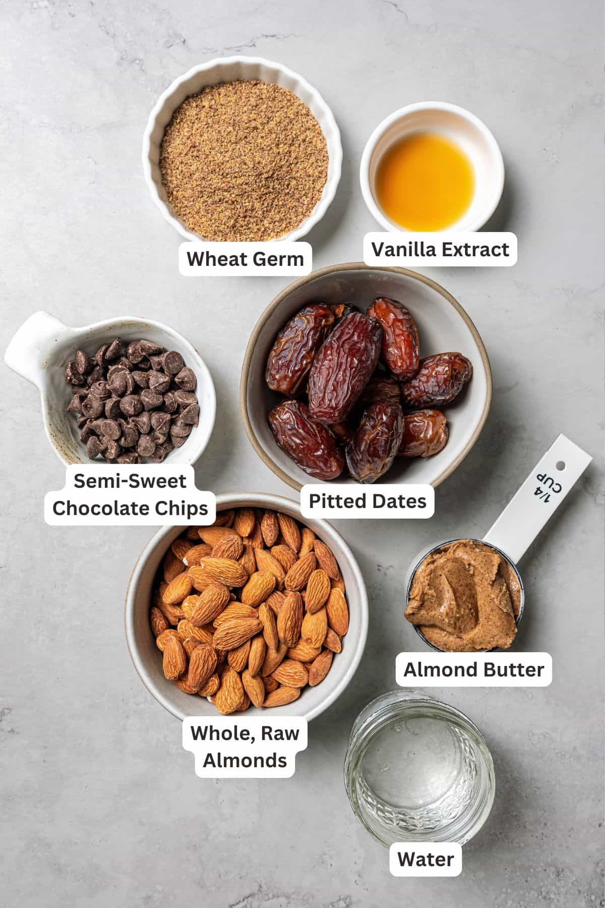 These easy no-bake energy balls are the perfect on-the-go snack packed with juicy dates, raw almonds, chocolate, and nut butter. No oats! Homemade energy ball ingredients with text labels overlaying each ingredient.