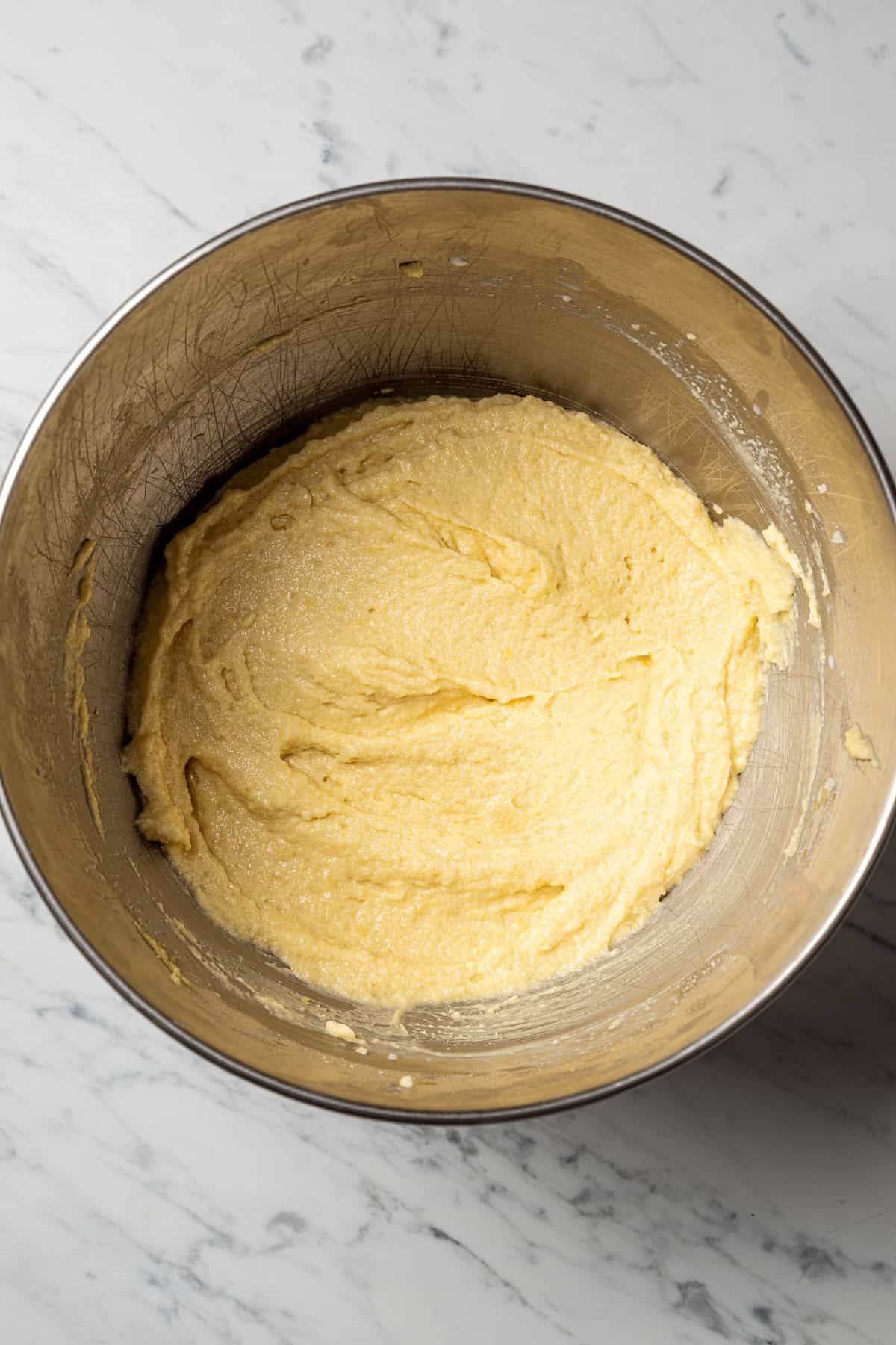 Semolina cake batter in a mixing bowl.