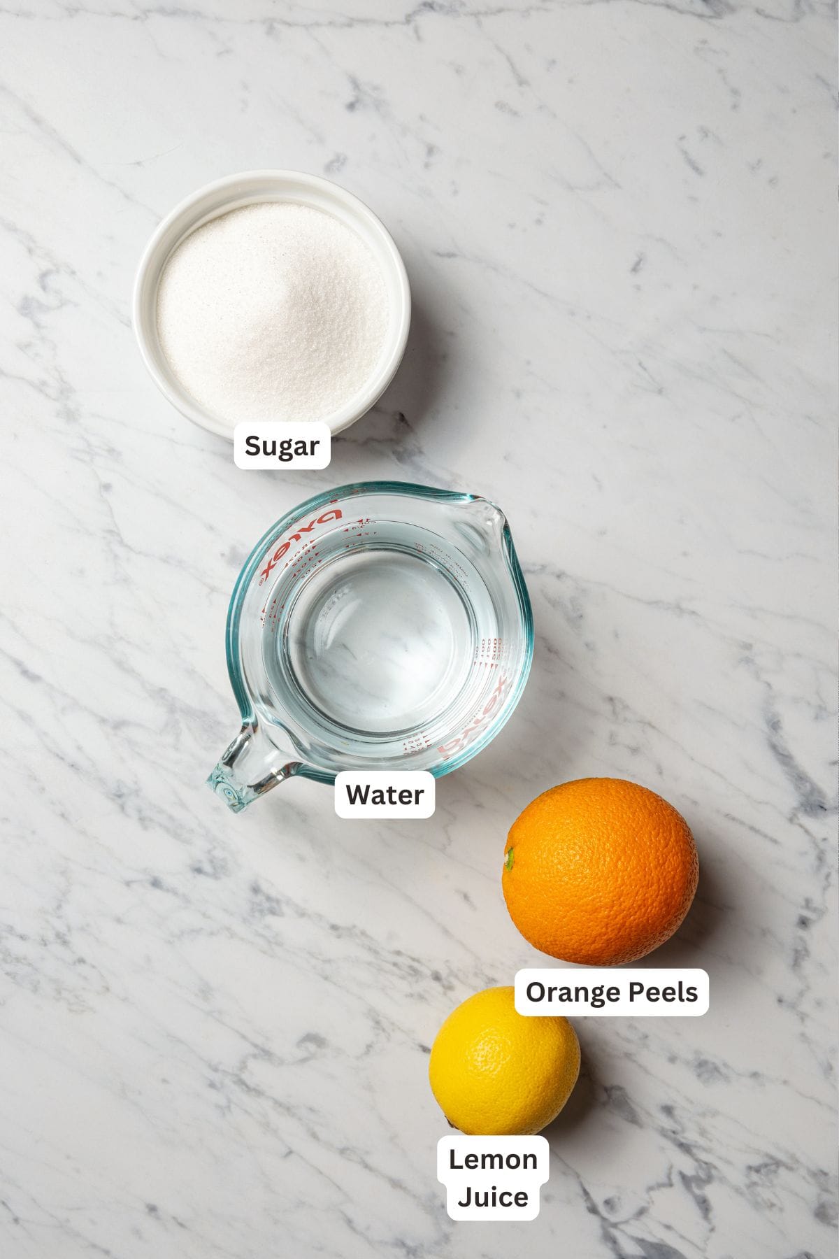 Citrus simple syrup ingredients with text labels overlaying each ingredient.