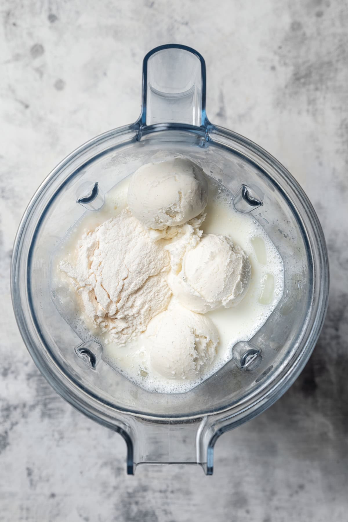Vanilla bean frappuccino ingredients combined inside a food processor.