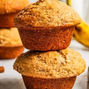 Two banana muffins stacked up.