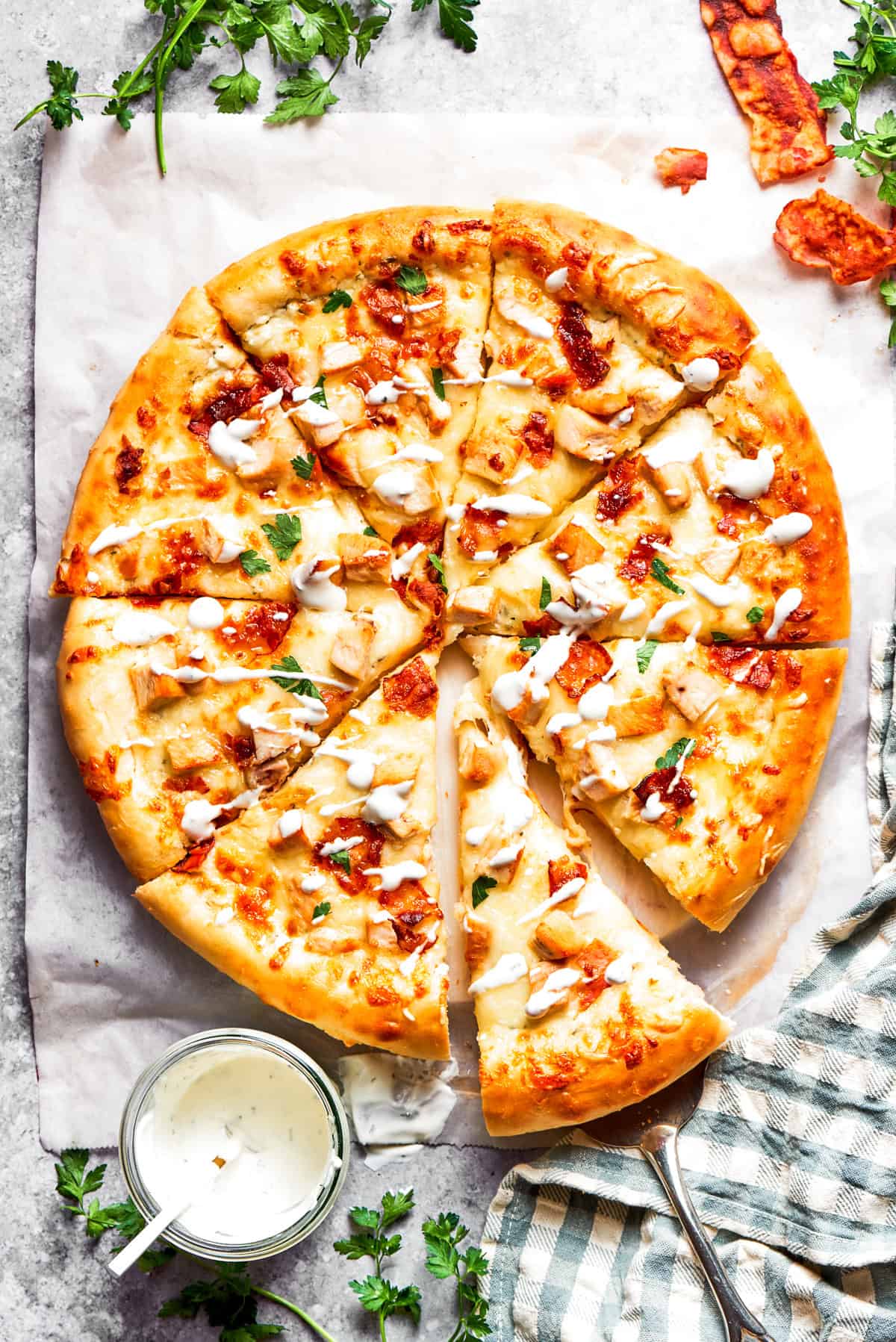 Chicken Bacon Ranch Pizza Homemade pizza topped with chicken bites, bacon, and ranch dressing.
