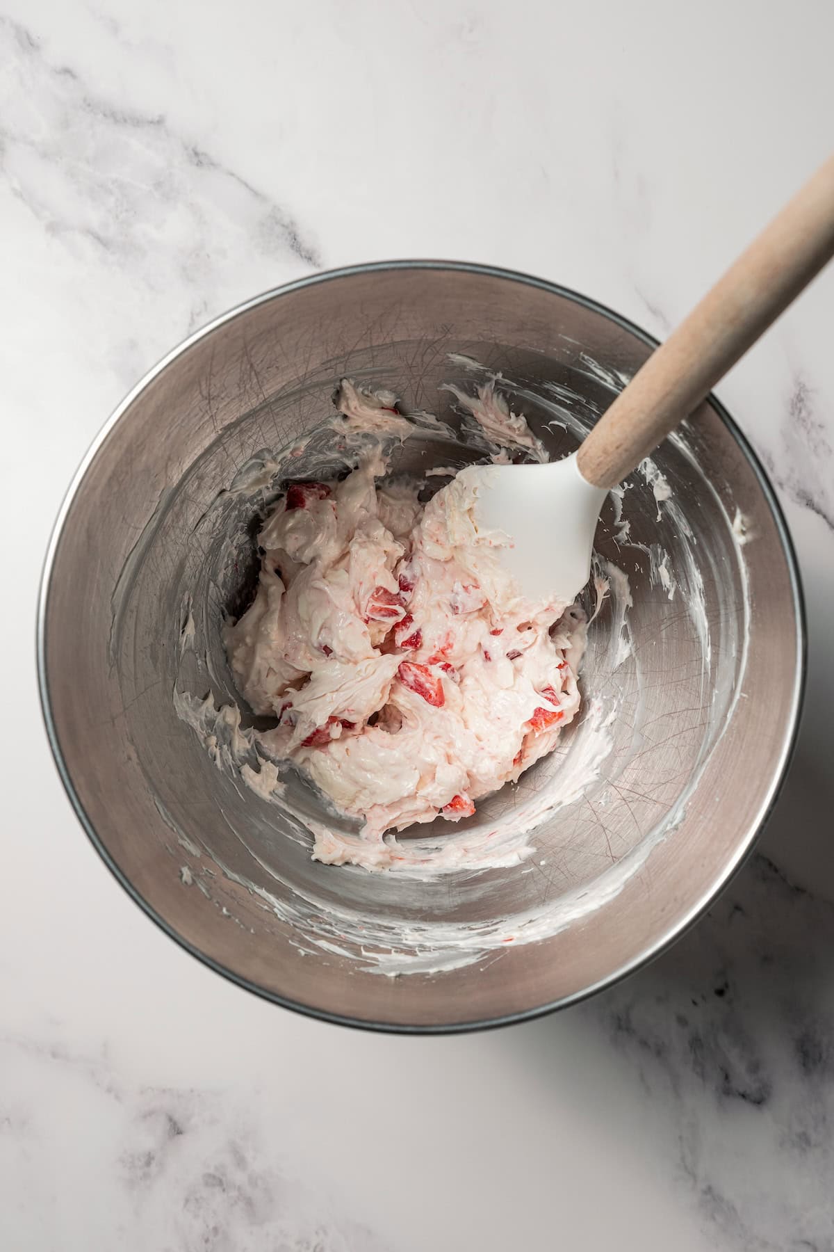 Strawberry cheesecake filling in a bowl.