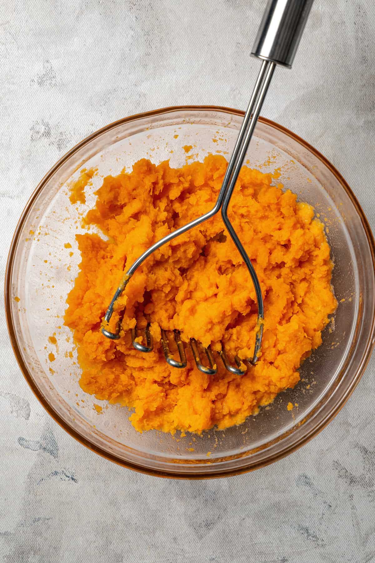 Mashed sweet potato in a bowl.