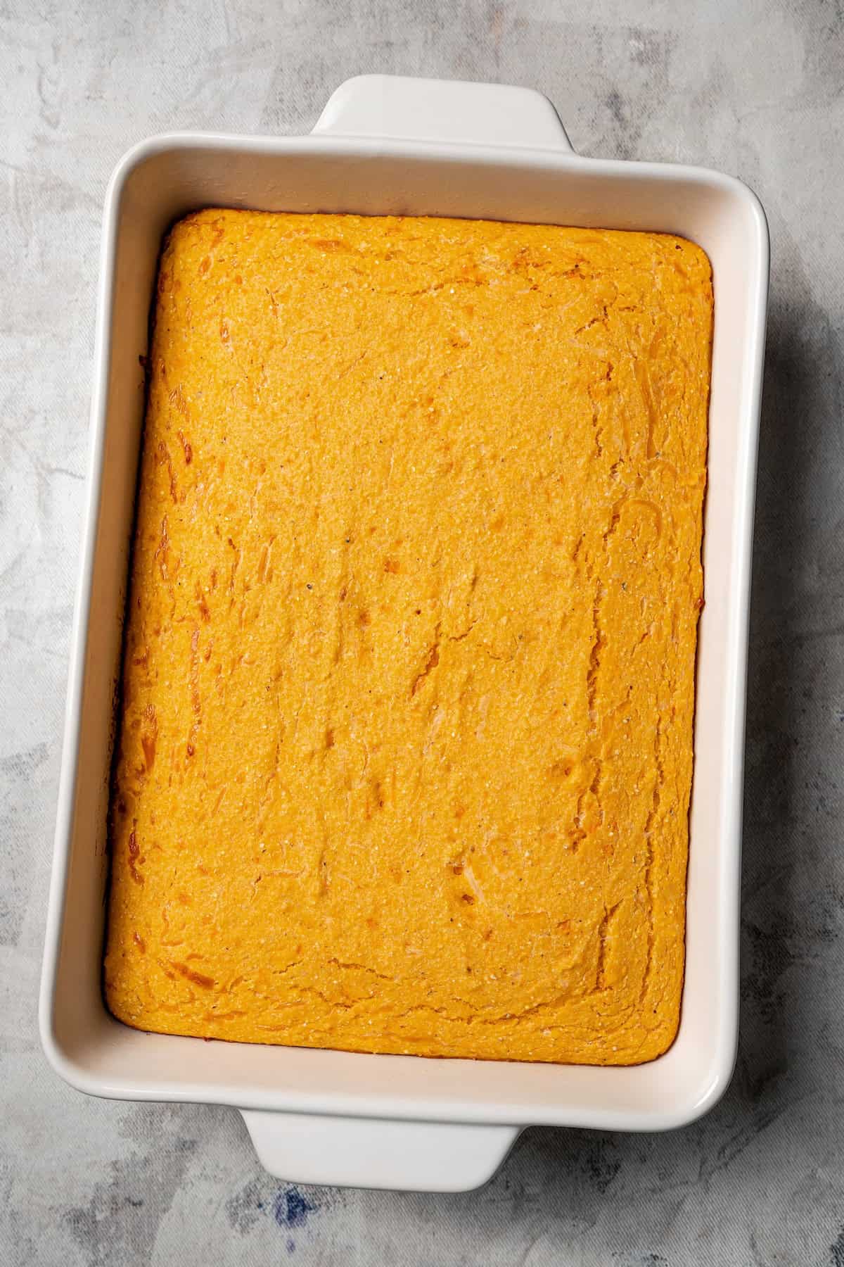 Baked sweet potato cornbread a casserole dish.