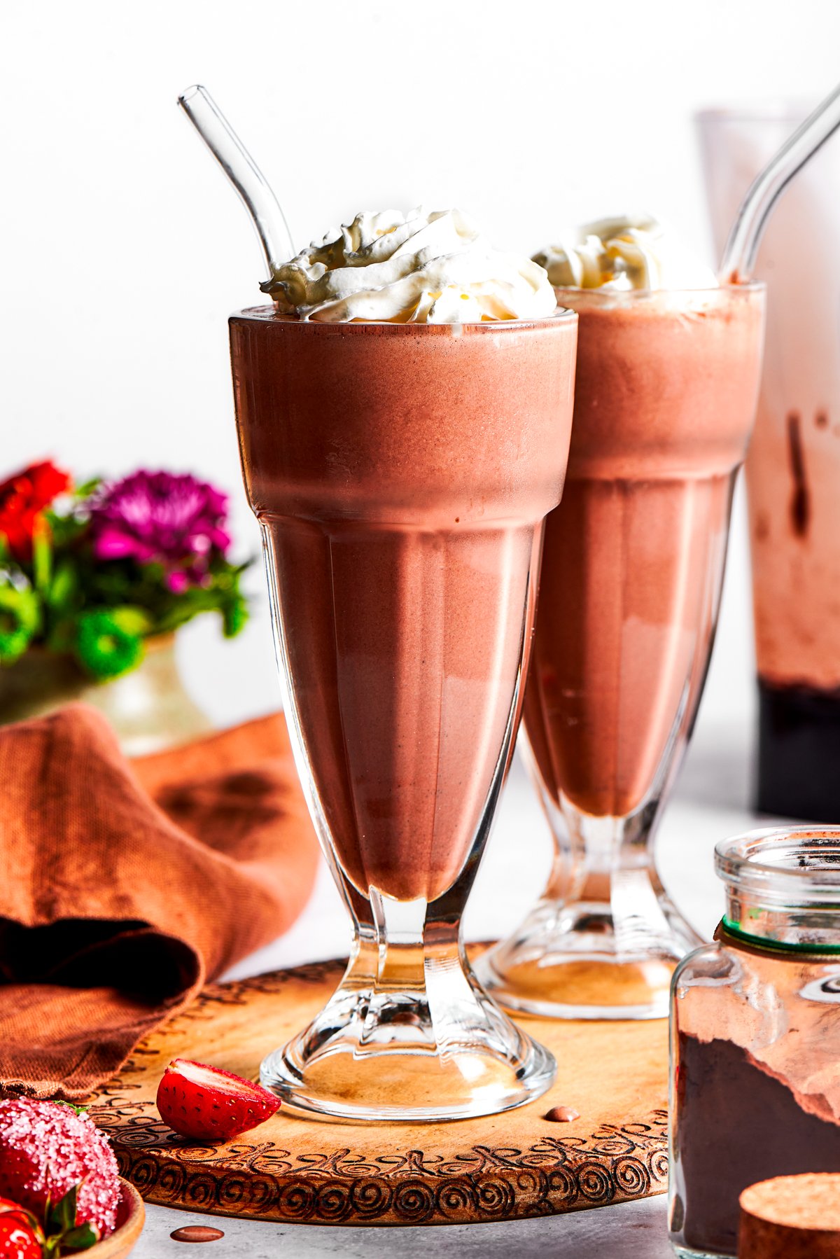 Chocolate Milkshake Chocolate milkshake served in two tall glasses.