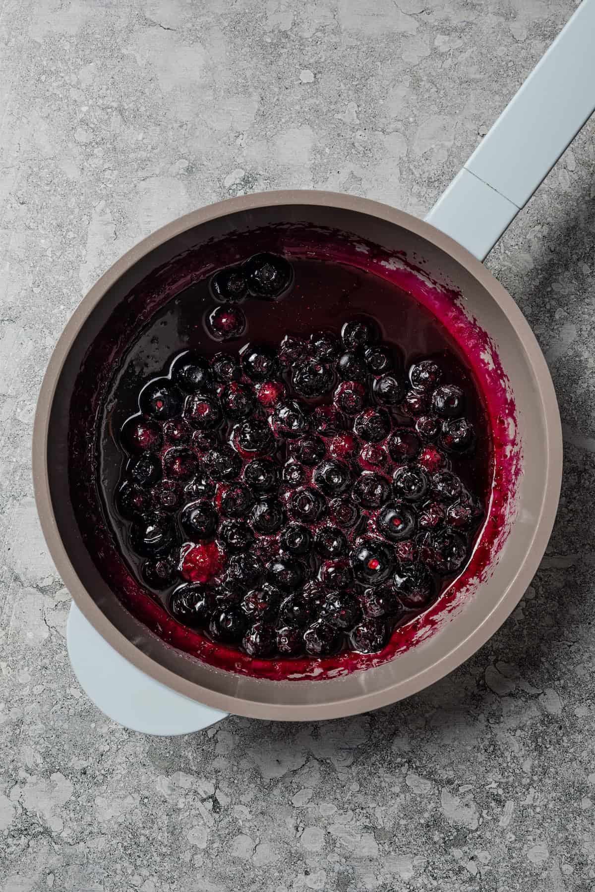 Blueberry sauce in a saucepan.