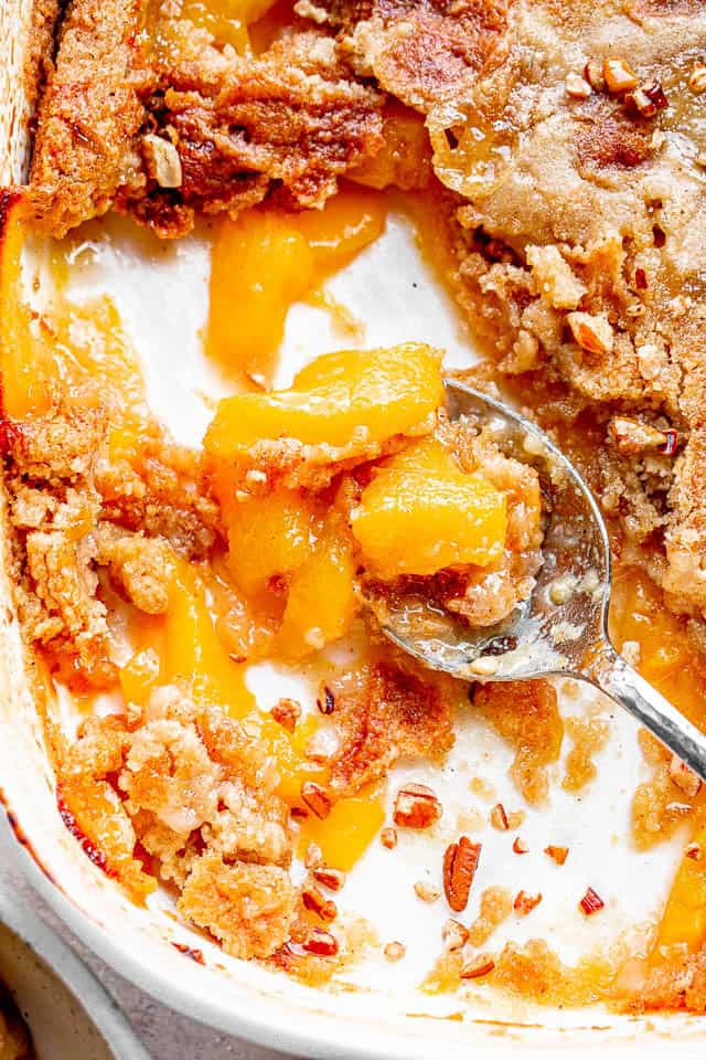 Peach dump cake in a casserole dish.