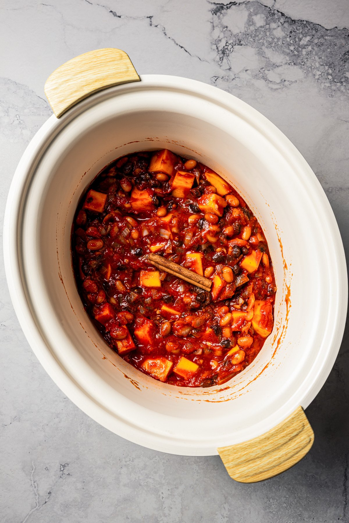 Cooked chili in a slow cooker bowl.