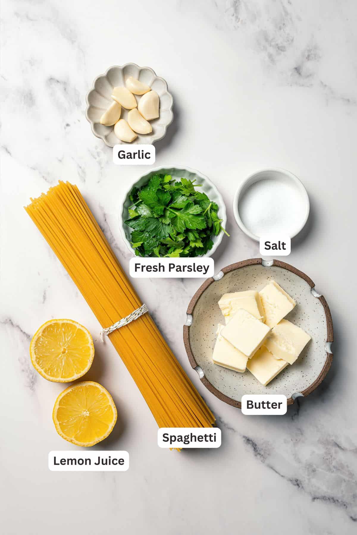 Garlic butter noodles ingredients with text labels overlaying each ingredient.