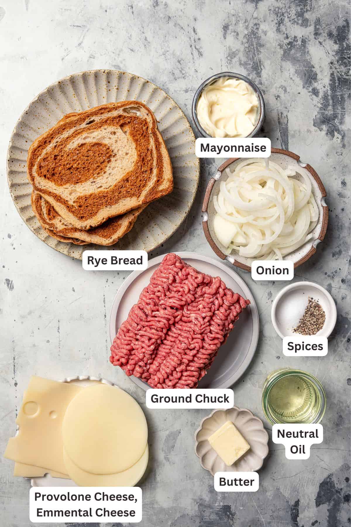 Patty melt ingredients with text labels overlaying each ingredient.