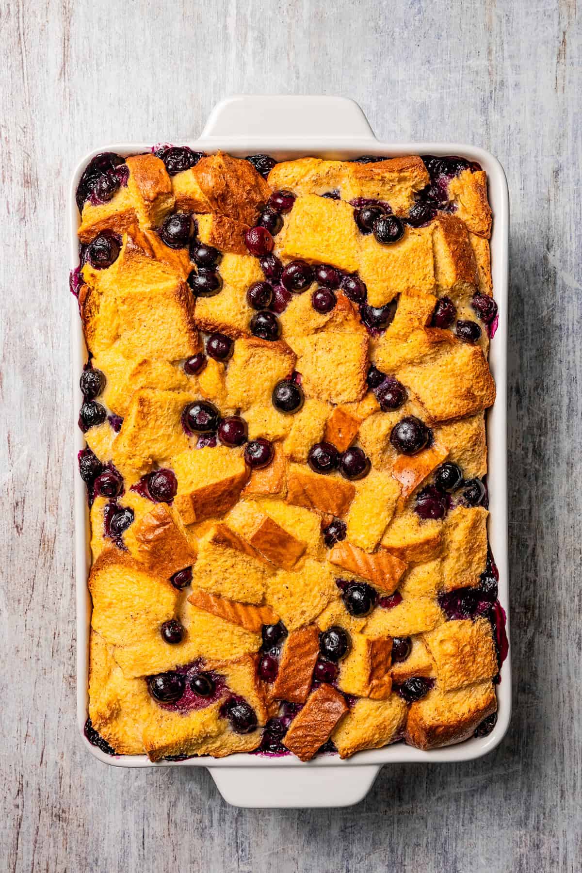 Baked bread pudding studded with fresh blueberries.