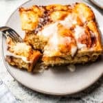 Cinnamon roll casserole piece served on a plate.